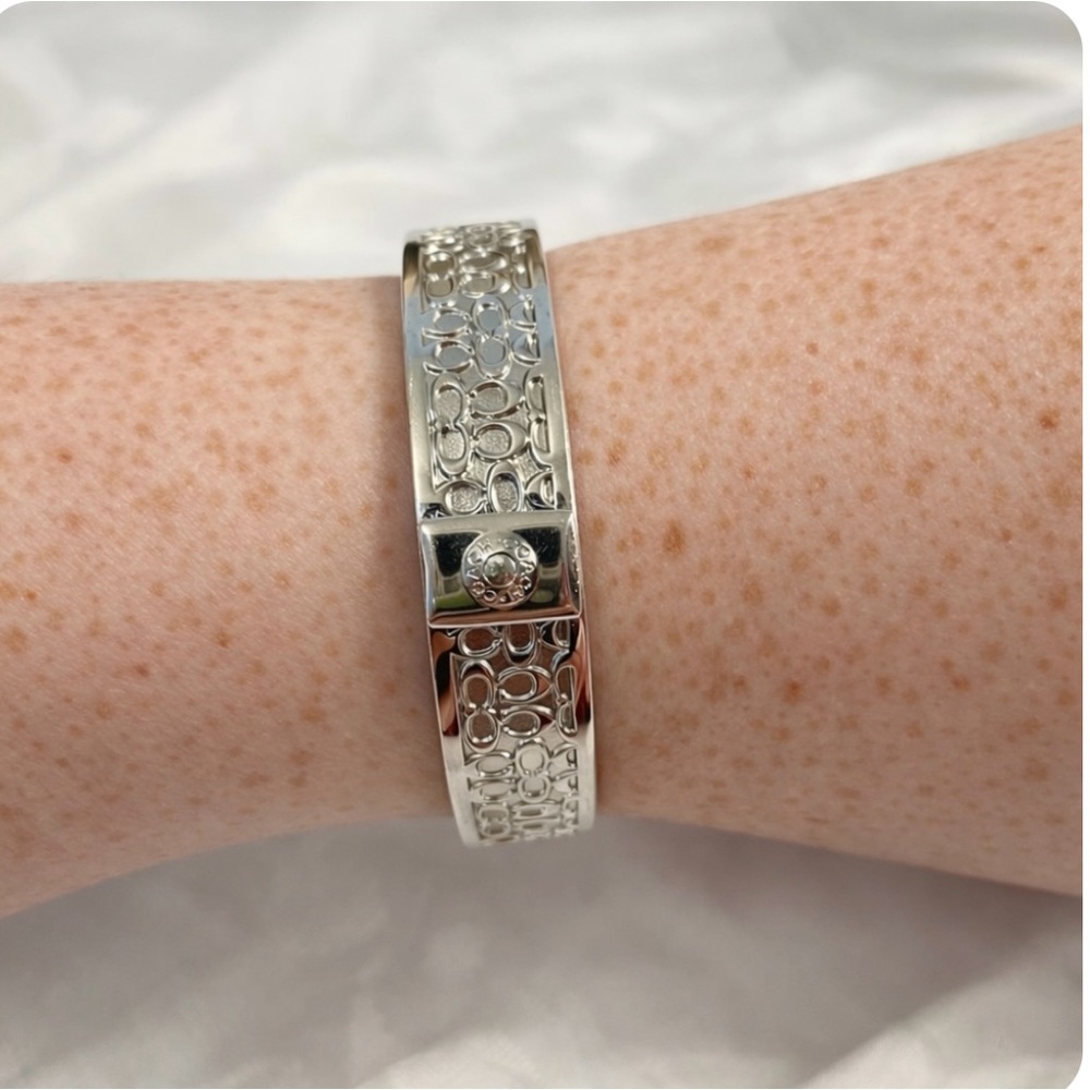 Quiet Luxury Silver Tone Cuff Bracelet with Intricate “C” Design
